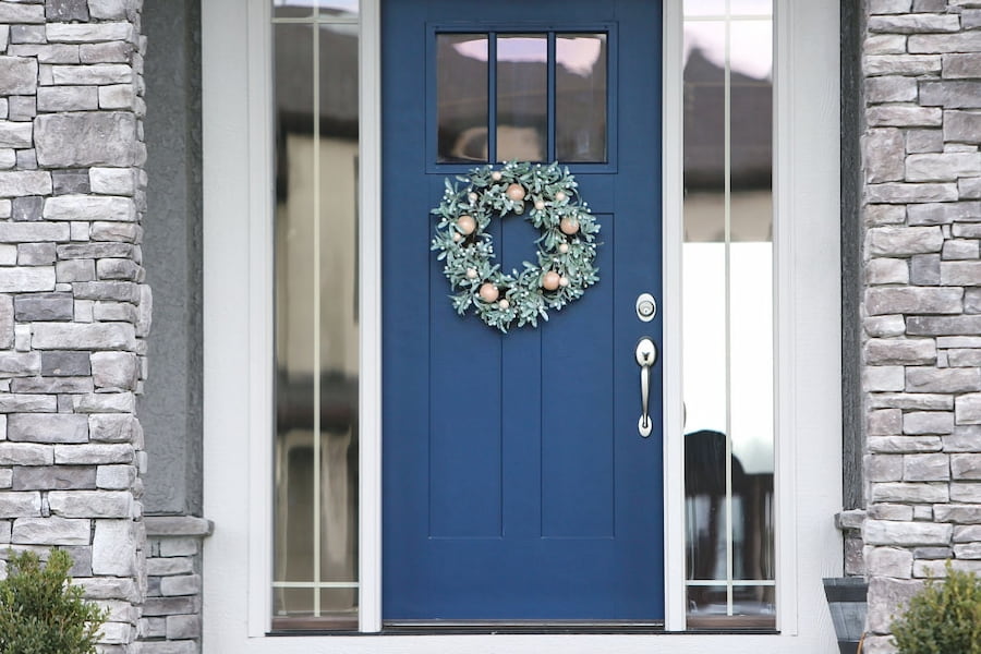 wreath on the blue front door