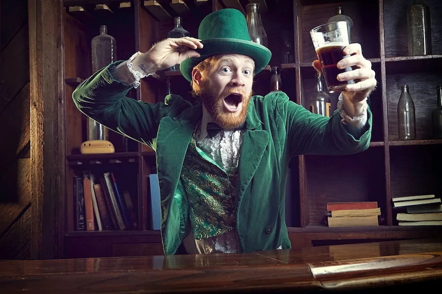 Leprechaun character Celebrating with Pint of Beer