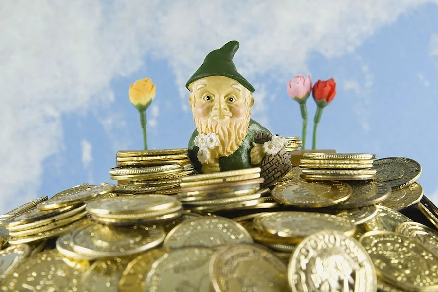 Pile of gold with leprechaun and flowers