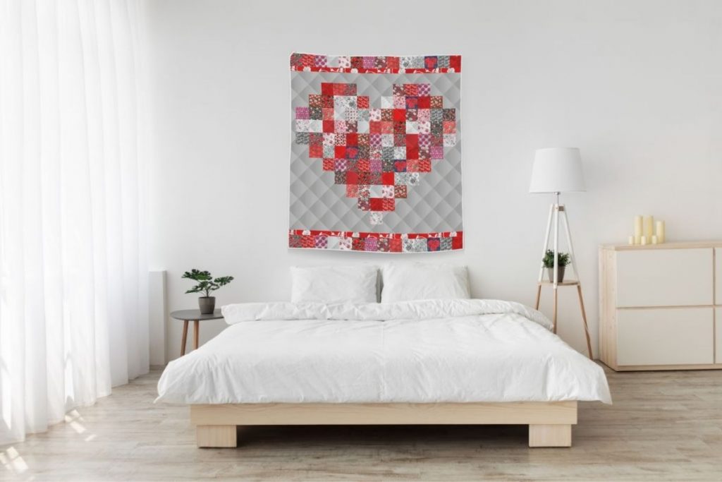 valentines day quilt hanging on wall