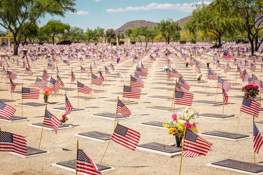 Decoration Of Graves With Flags On Memorial Day