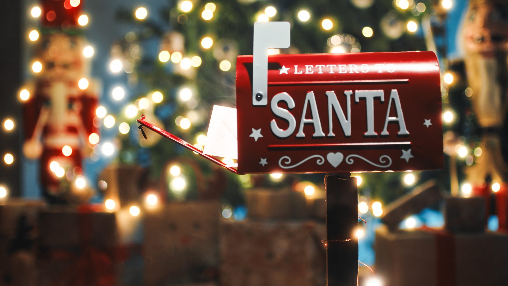 Santa Claus red mailbox under Christmas tree